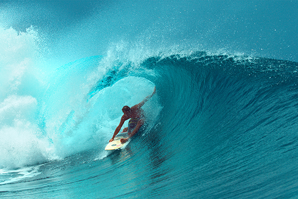 CLOSE UP: Professional surfboarder finishes riding another epic